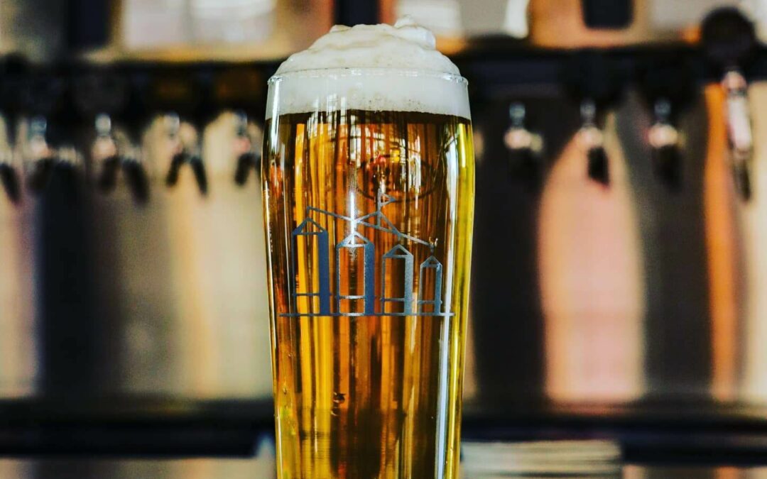 Glass of beer with foam.