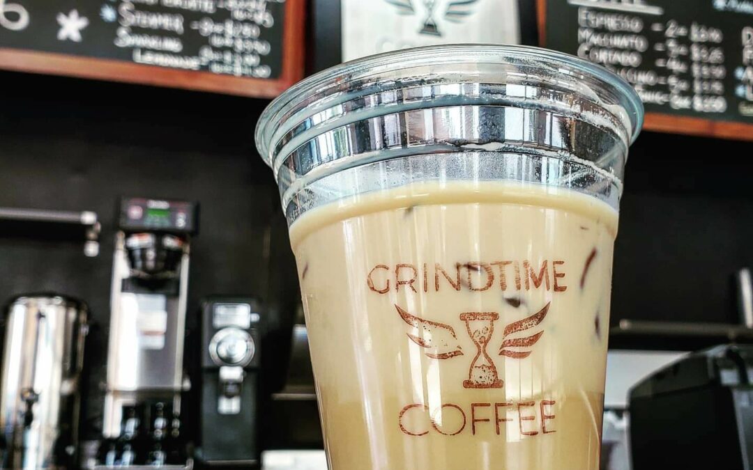 Iced coffee in a to-go cup. GrindTime Coffee.
