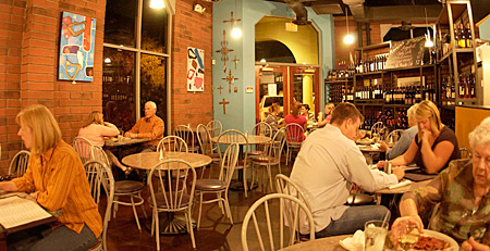 Several people inside Romeo's Euro Cafe.