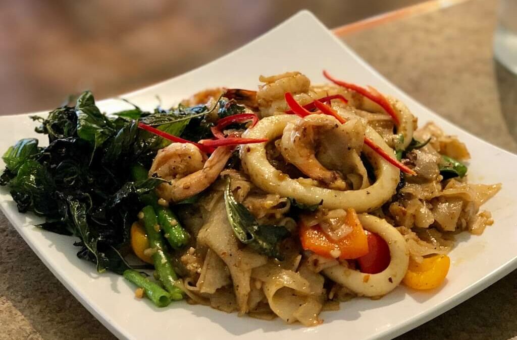Plate with chicken, calamari and greens