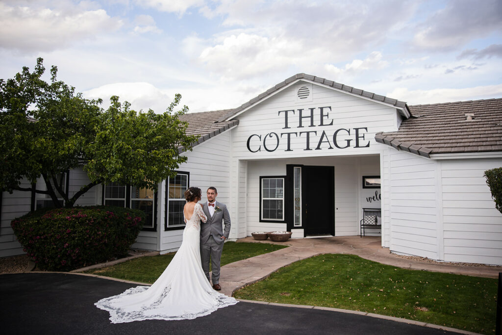 Bride and groom in front of The Cottage
