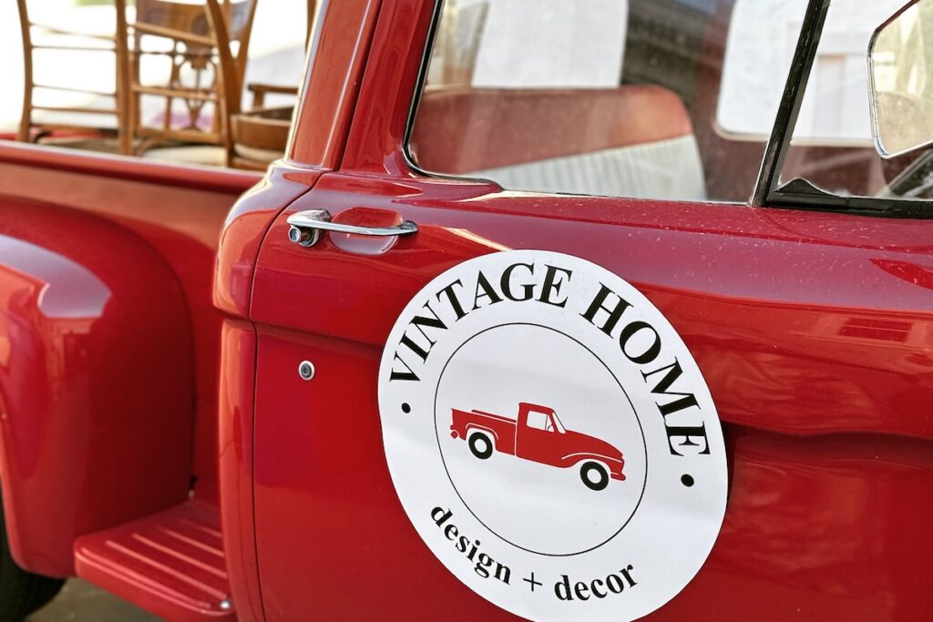 Vintage Home Design and Decor sign on red truck
