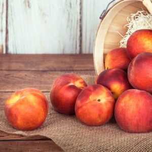 Fresh Peach Fruits In A Basket, Rustic Wooden Background